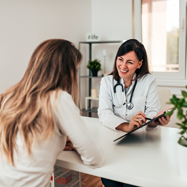 Female doctor explaining diagnosis to her young patient